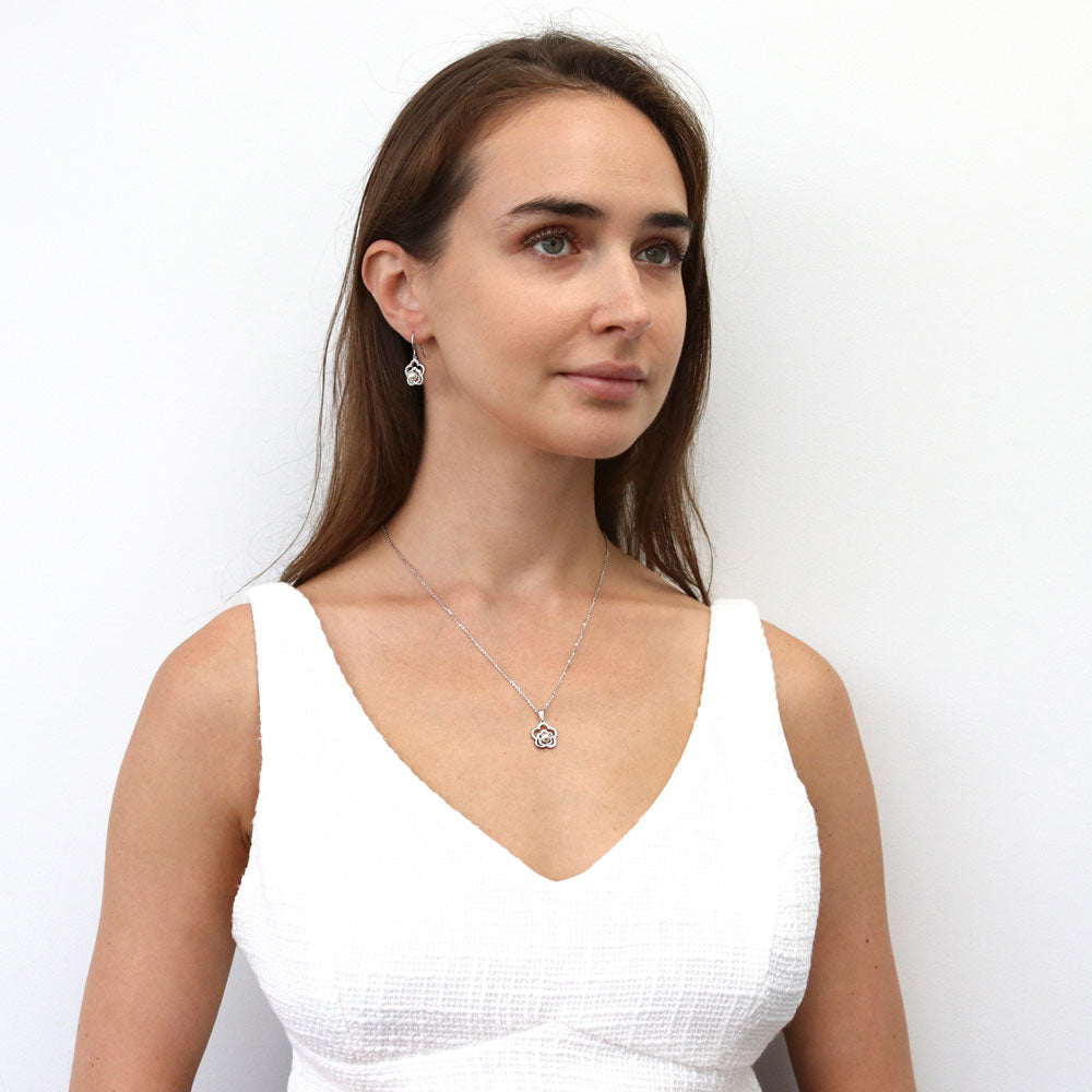 Model wearing Flower Imitation Pearl Necklace and Earrings Set in Sterling Silver