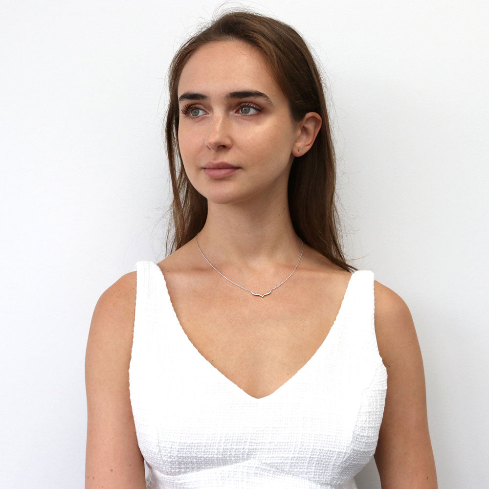 Model wearing Chevron Wishbone Pendant Necklace in Sterling Silver