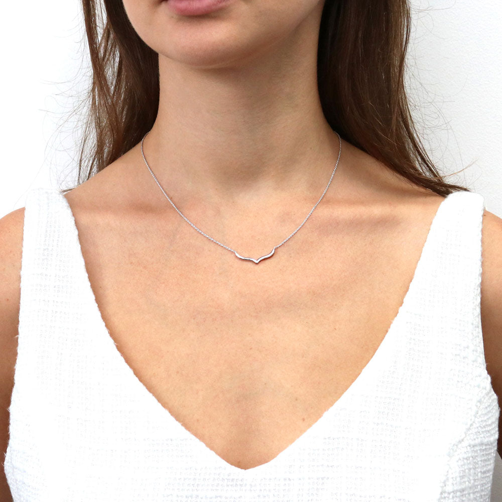 Model wearing Chevron Wishbone Pendant Necklace in Sterling Silver