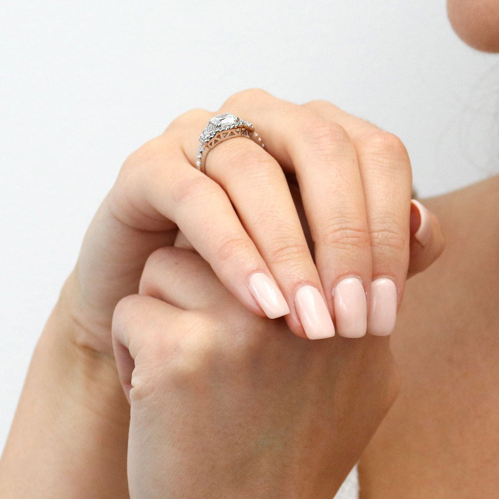 Model wearing 3-Stone Halo Cushion CZ Ring in Sterling Silver