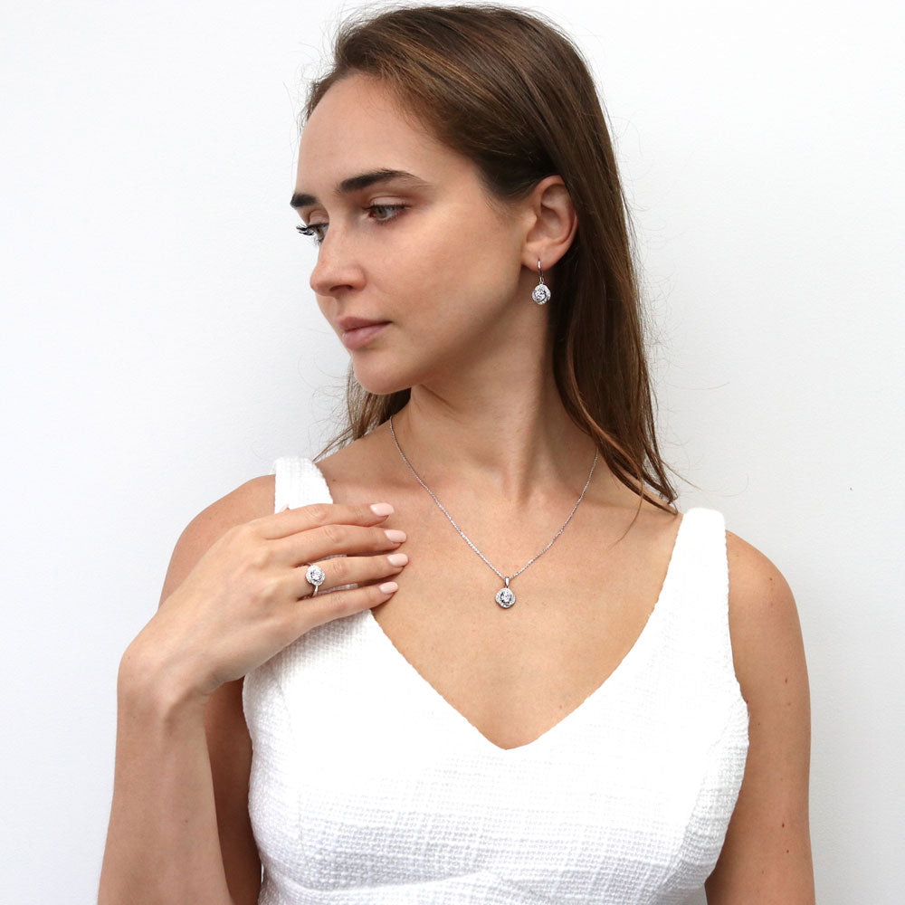 Model wearing Flower Woven CZ Fish Hook Dangle Earrings in Sterling Silver