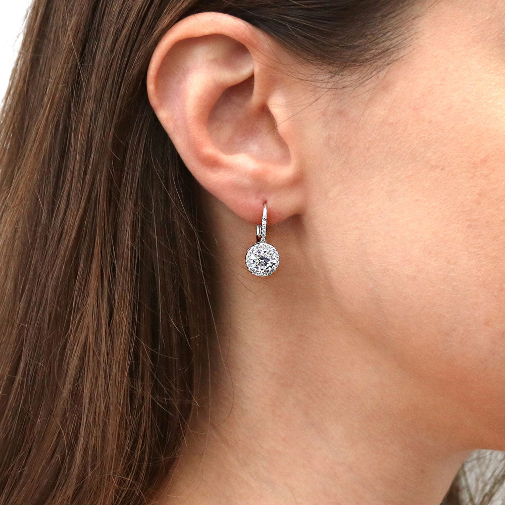Model wearing Solitaire 2.5ct Round CZ Leverback Dangle Earrings in Sterling Silver