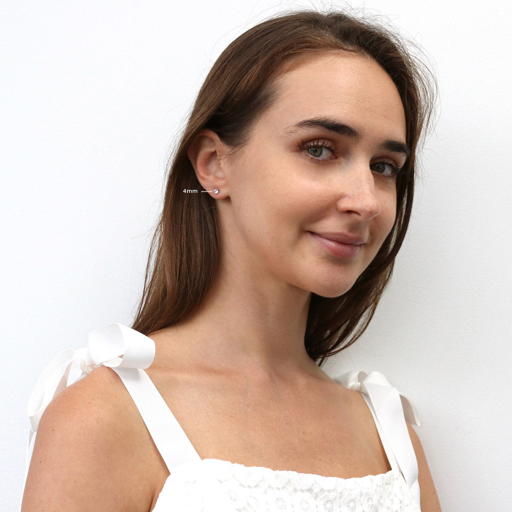 Model Wearing Solitaire Stud Earrings Style E1809-01