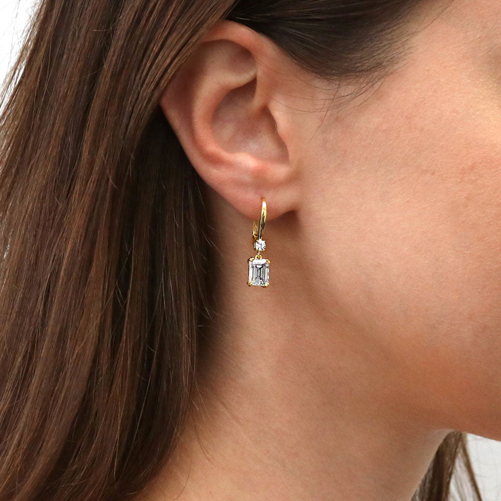 Model wearing Solitaire 3.4ct Emerald Cut CZ Leverback Earrings in Sterling Silver