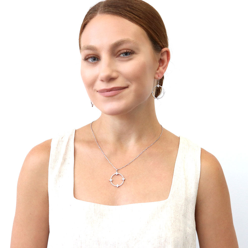 Model wearing Flower Open Circle CZ Necklace and Earrings Set in Sterling Silver