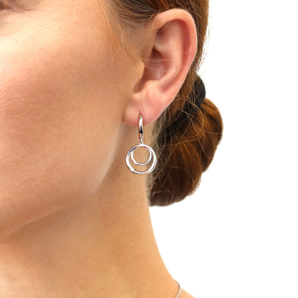 Model wearing Open Circle Dangle Earrings in Sterling Silver