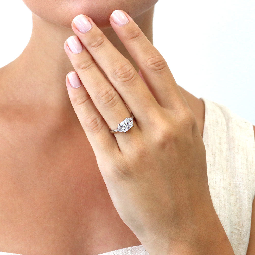Model wearing 3-Stone Princess CZ Ring in Sterling Silver, 3 of 9