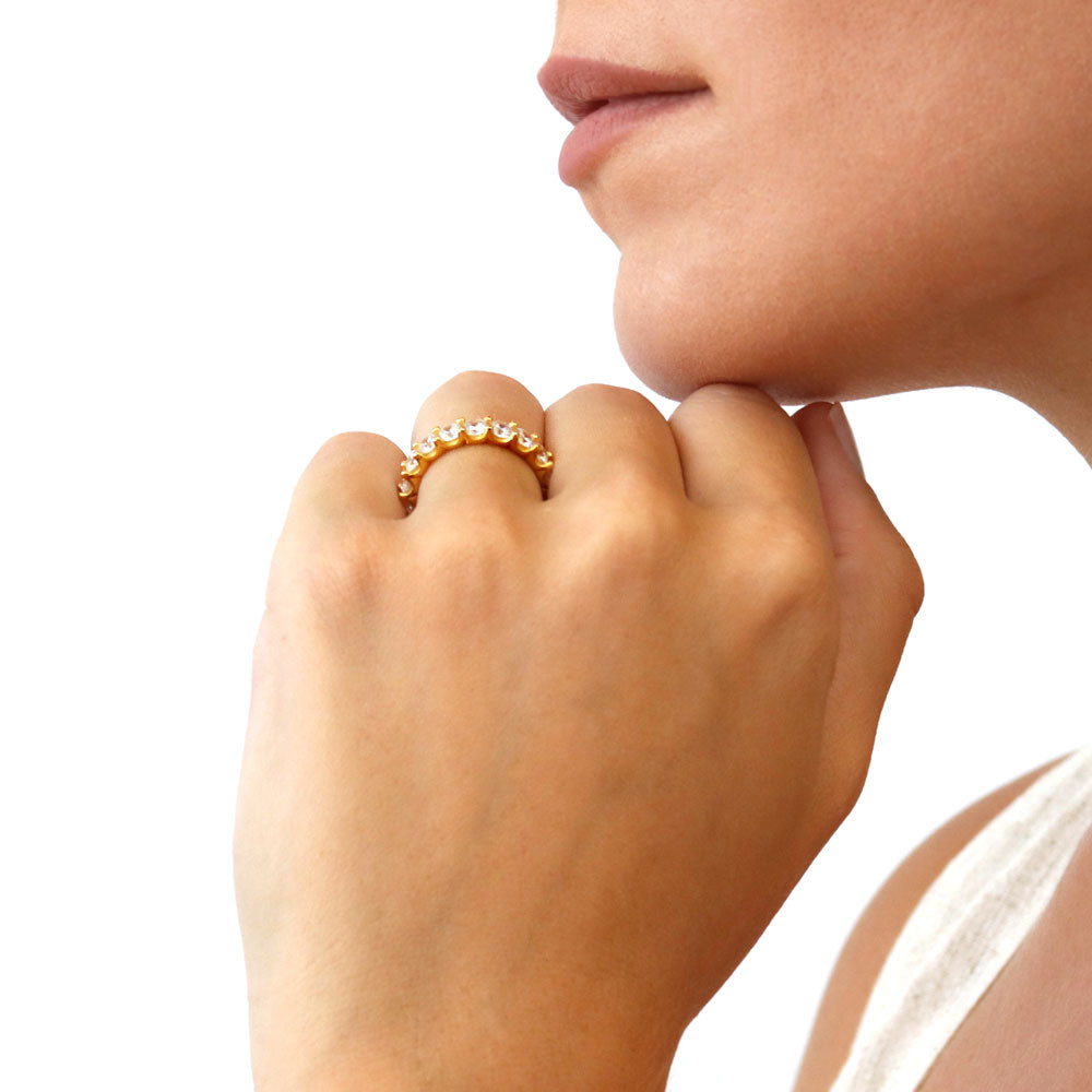 Model wearing Pave Set CZ Eternity Ring in Gold Flashed Sterling Silver