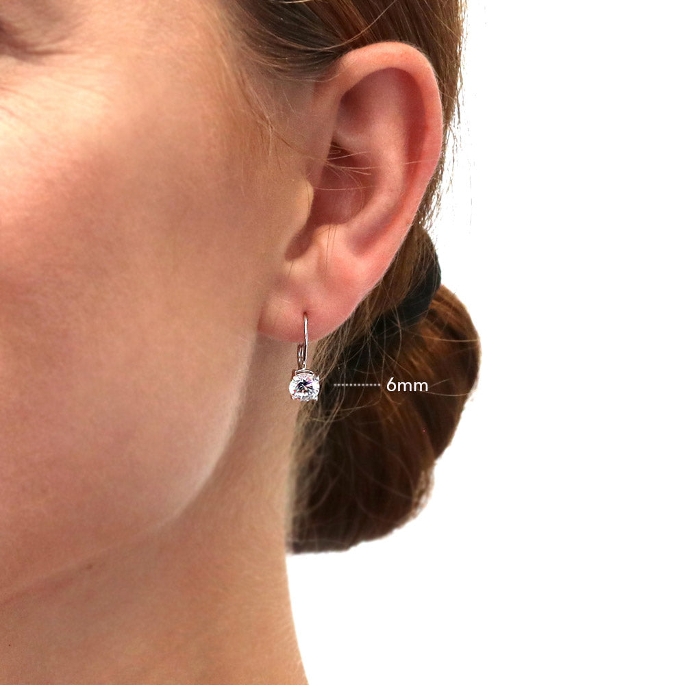 Model wearing Solitaire Round CZ Leverback Dangle Earrings in Sterling Silver