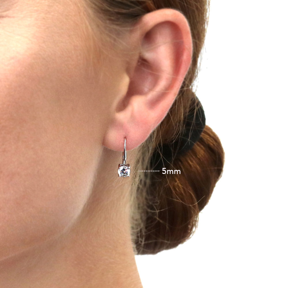 Model wearing Solitaire Round CZ Leverback Dangle Earrings in Sterling Silver