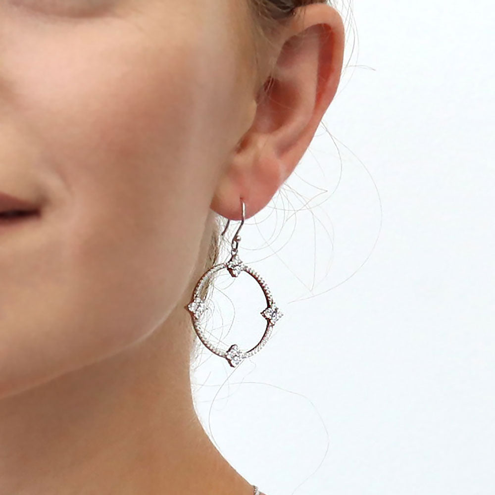 Model wearing Open Circle Flower CZ Fish Hook Dangle Earrings in Sterling Silver