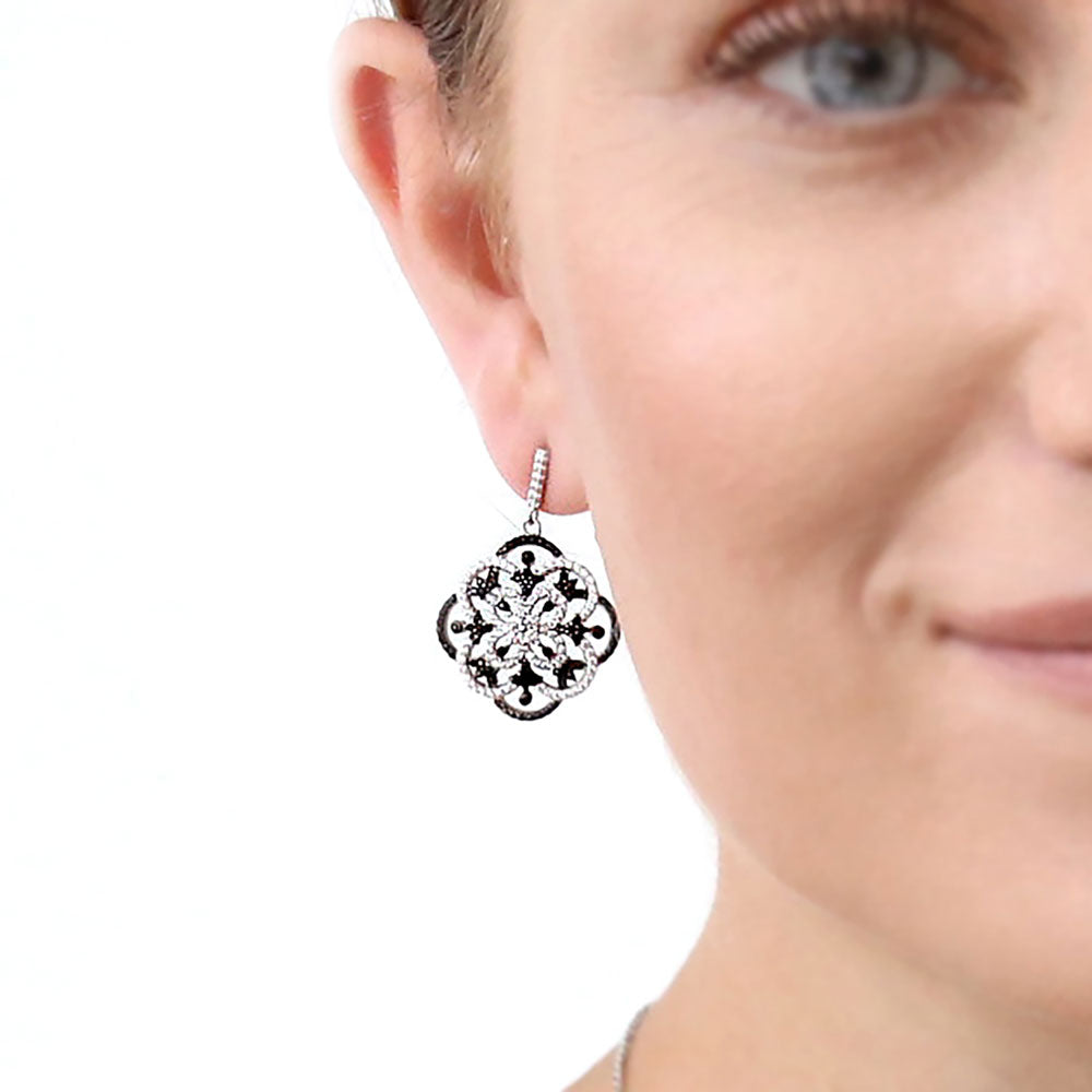 Model wearing Flower Black and White CZ Statement Dangle Earrings in Sterling Silver