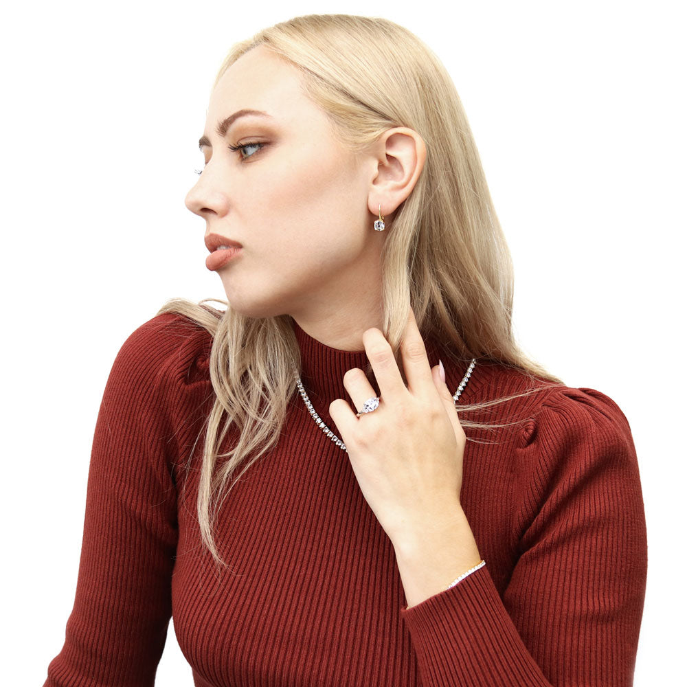 Model wearing Solitaire 4ct Cushion CZ Leverback Dangle Earrings in Sterling Silver