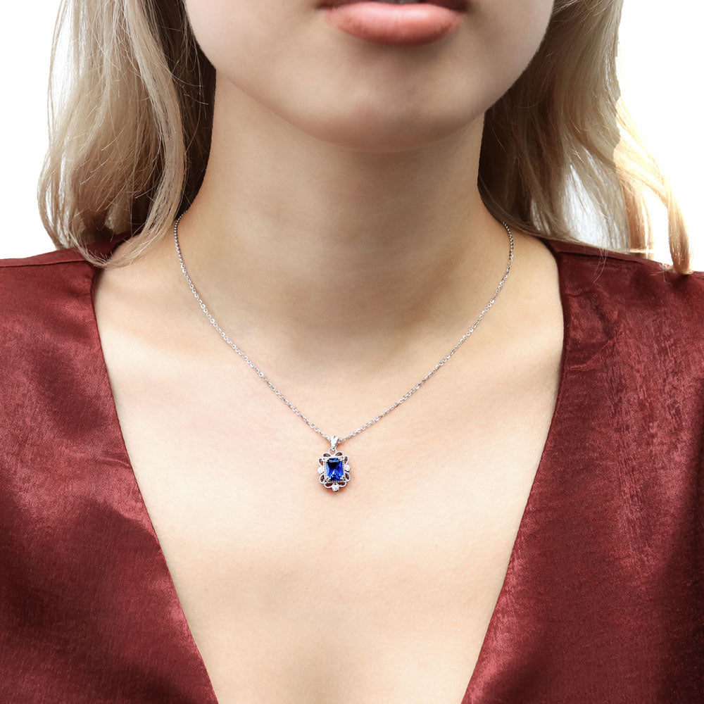 Model wearing Milgrain Simulated Blue Sapphire CZ Pendant Necklace in Sterling Silver