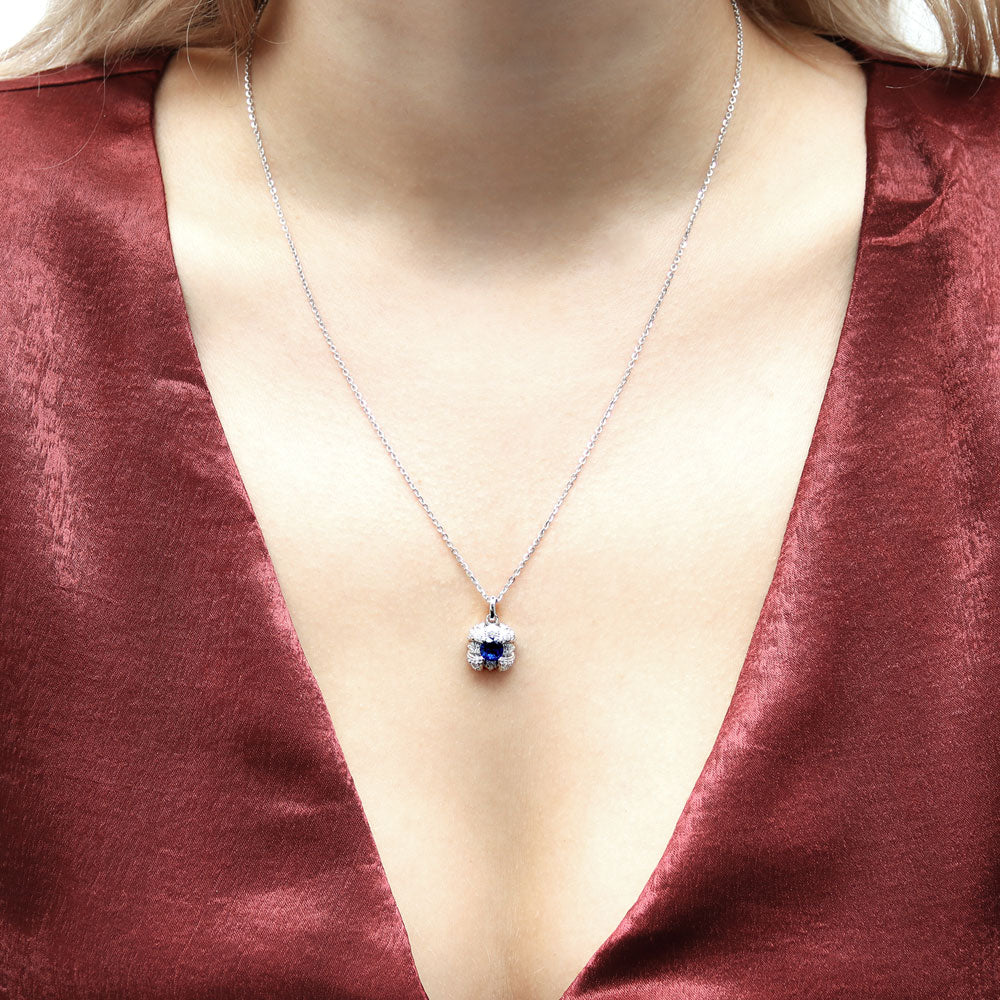 Model wearing Square Simulated Blue Sapphire CZ Set in Sterling Silver