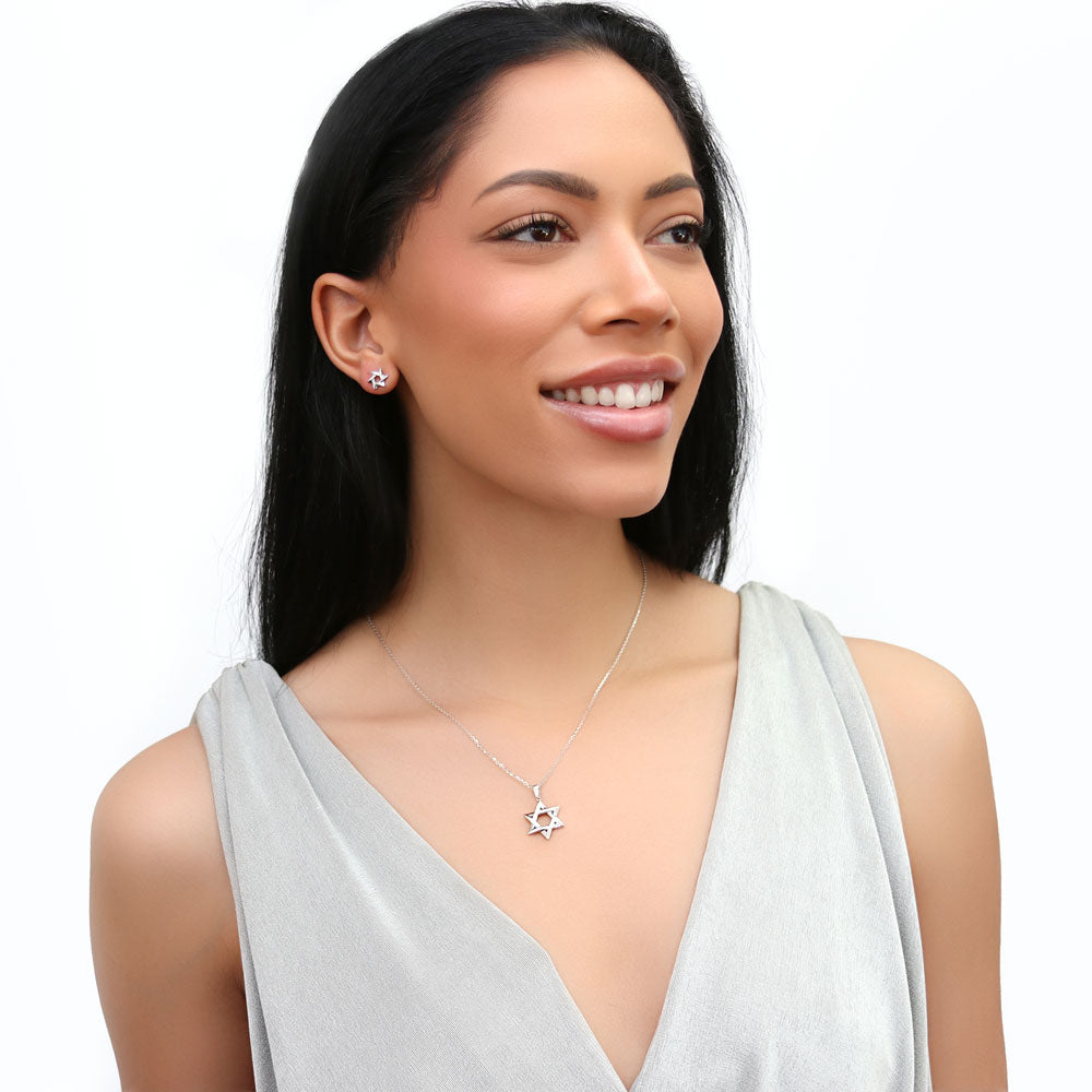 Model wearing Star of David Stud Earrings in Sterling Silver