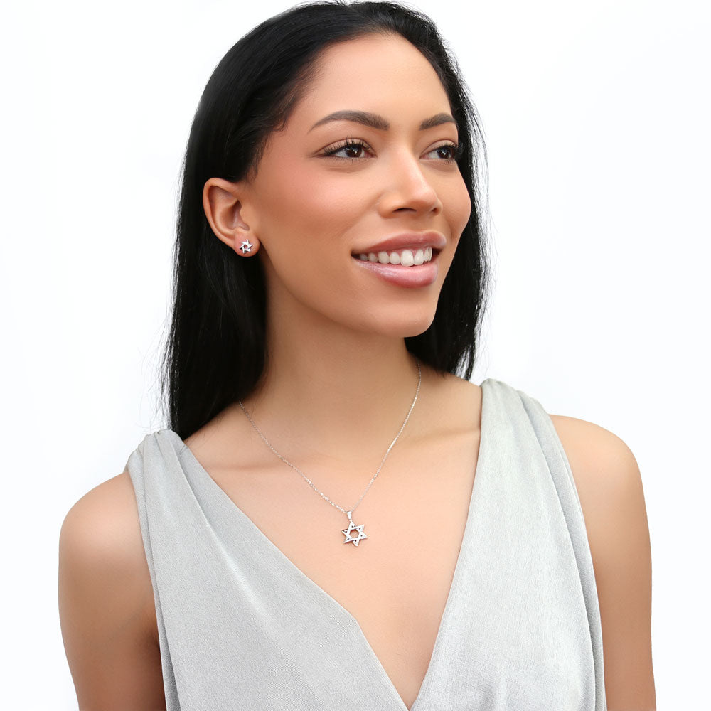 Model wearing Star of David Necklace and Earrings Set in Sterling Silver