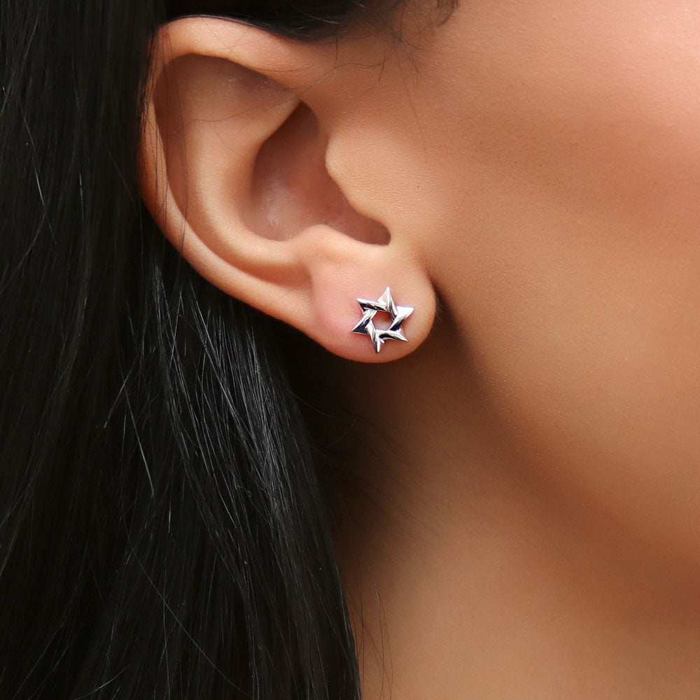 Model wearing Star of David Stud Earrings in Sterling Silver