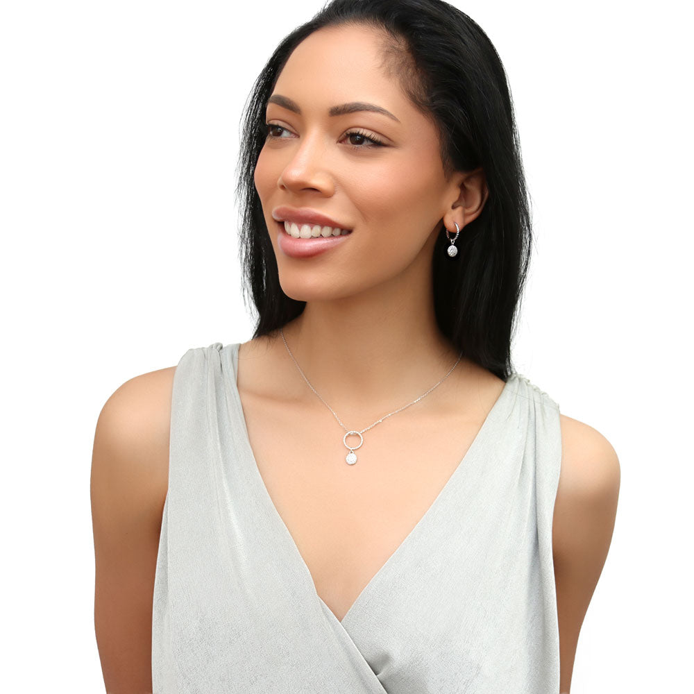 Model wearing Disc Open Circle CZ Necklace and Hoop Earrings Set in Sterling Silver