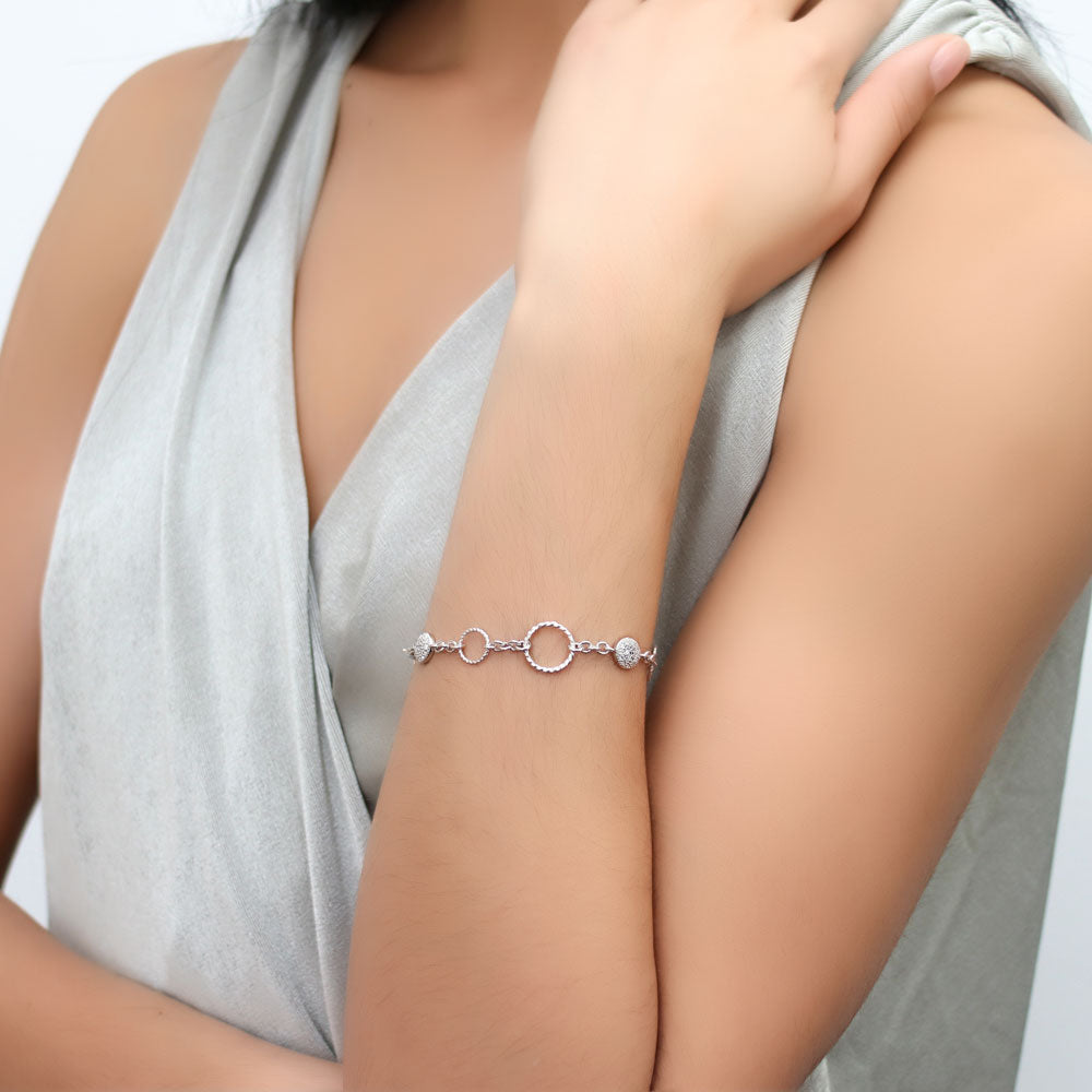 Model wearing Open Circle Cable CZ Link Bracelet in Sterling Silver