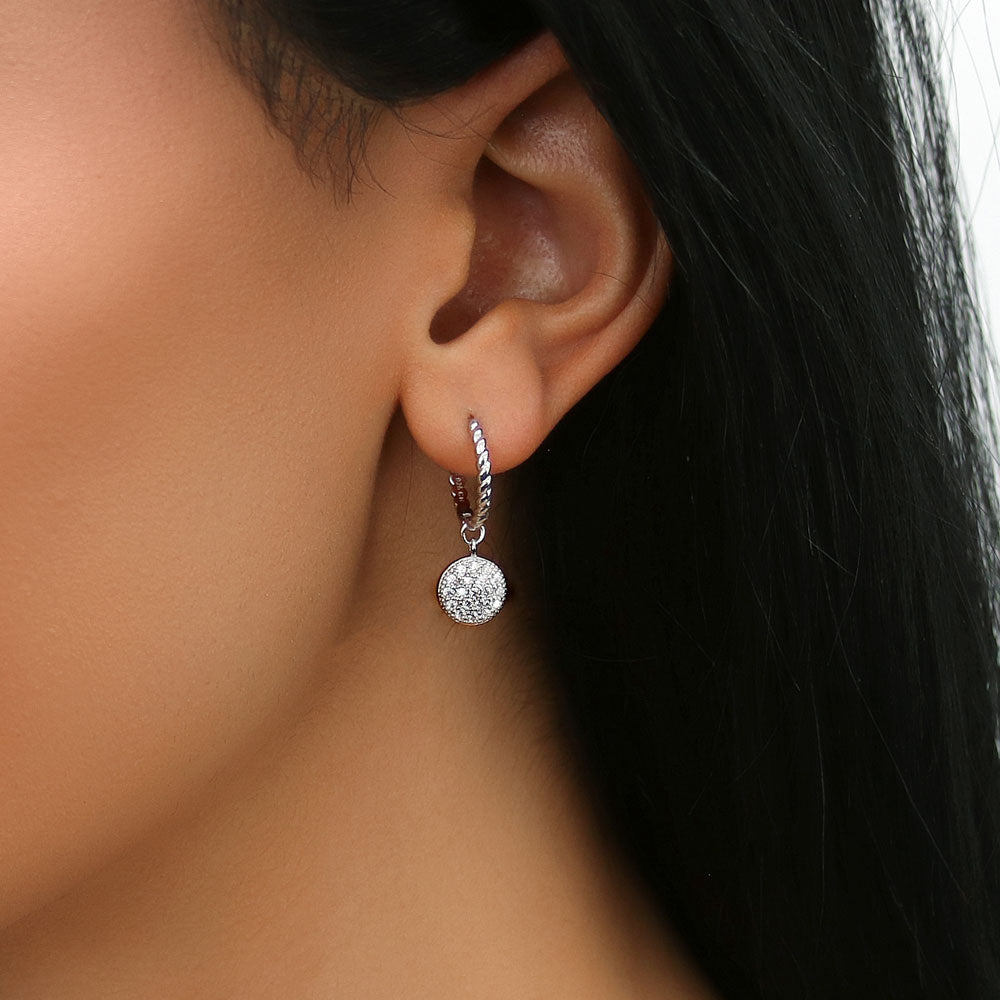 Model wearing Round Disc CZ Medium Hoop Earrings in Sterling Silver 1 inch