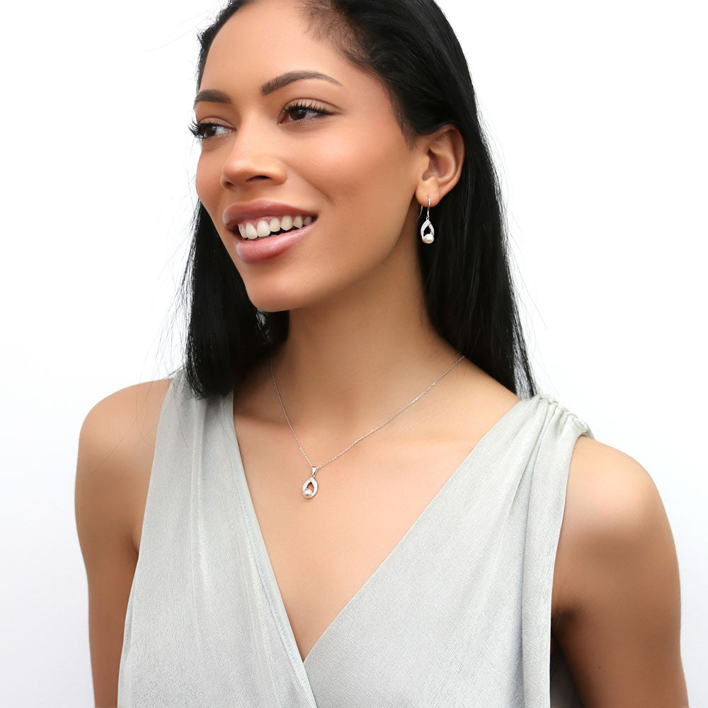 Model wearing Woven Imitation Pearl Fish Hook Dangle Earrings in Sterling Silver