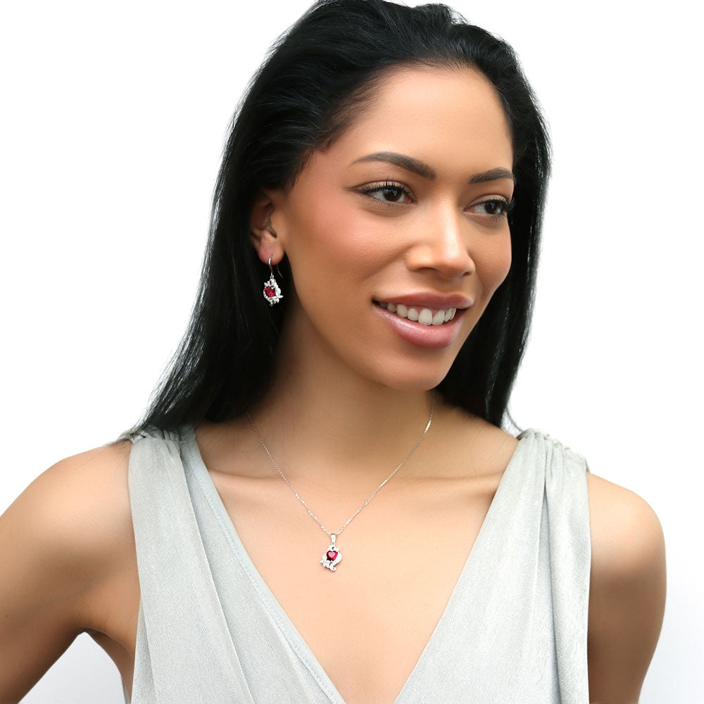 Model wearing Heart Flower CZ Fish Hook Dangle Earrings in Sterling Silver