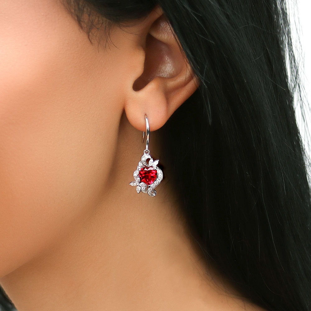 Model wearing Heart Flower CZ Fish Hook Dangle Earrings in Sterling Silver