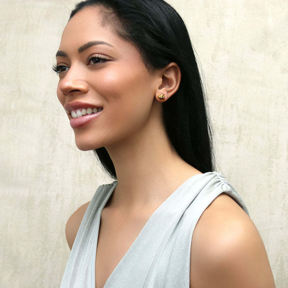 Model wearing Love Knot Stud Earrings in Sterling Silver