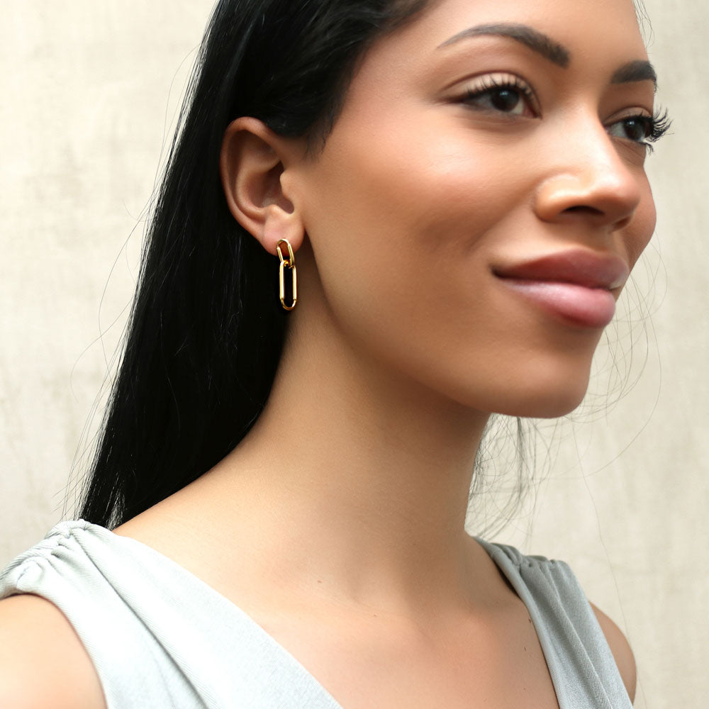 Model wearing Paperclip Interlocking Dangle Earrings in Sterling Silver