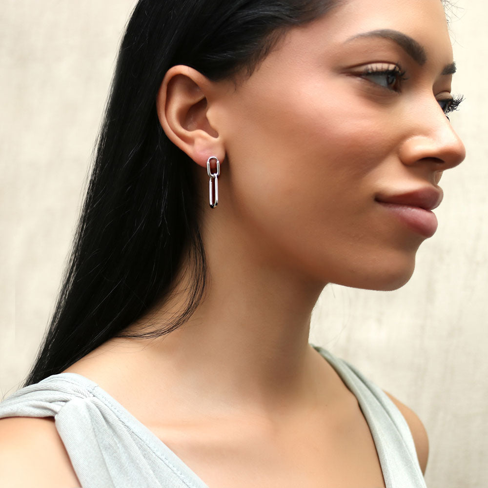 Model wearing Paperclip Interlocking Dangle Earrings in Sterling Silver, 7 of 11