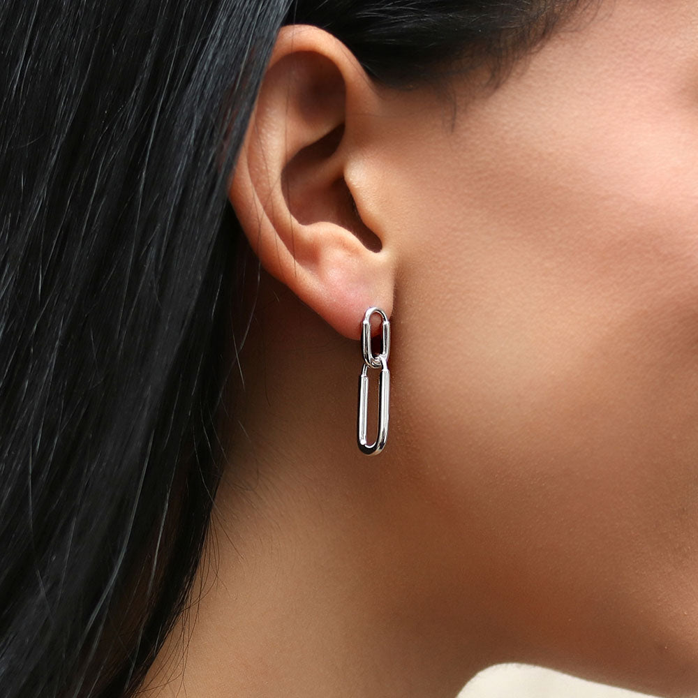 Model wearing Paperclip Interlocking Dangle Earrings in Sterling Silver