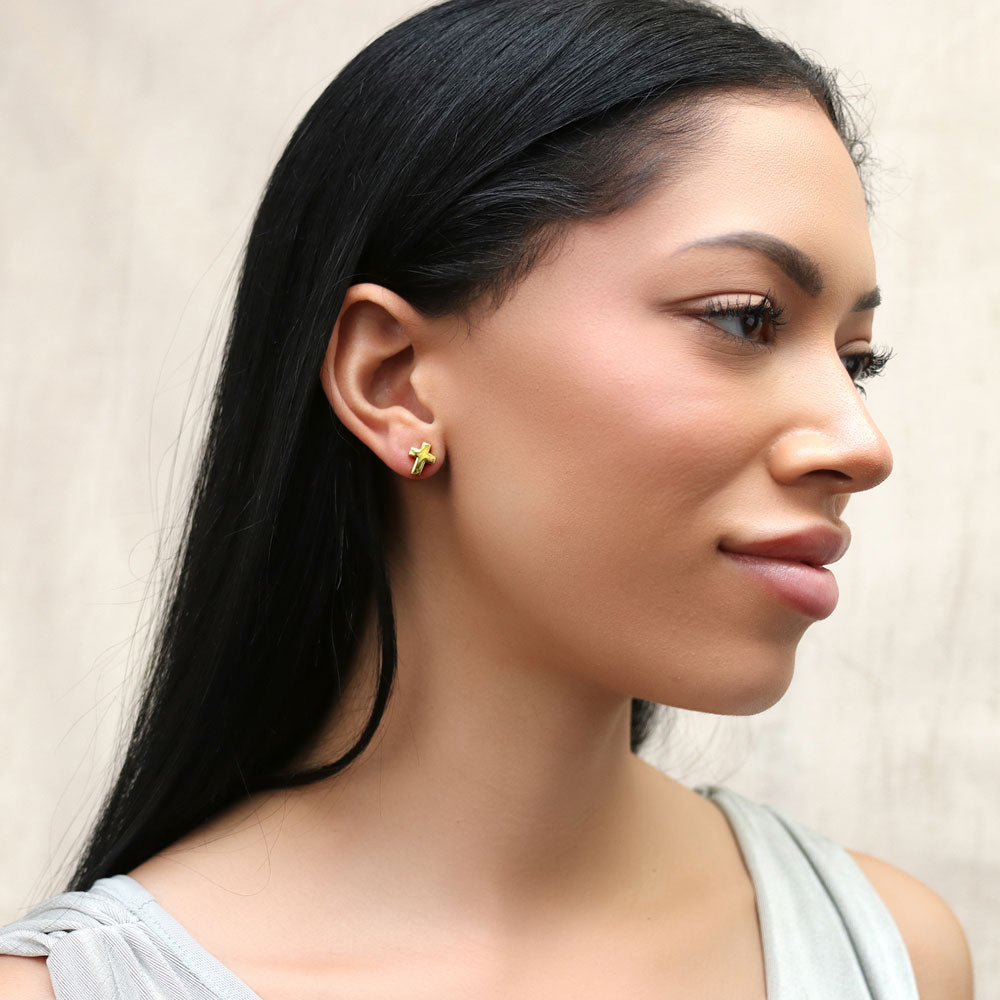 Model wearing Cross Stud Earrings in Sterling Silver