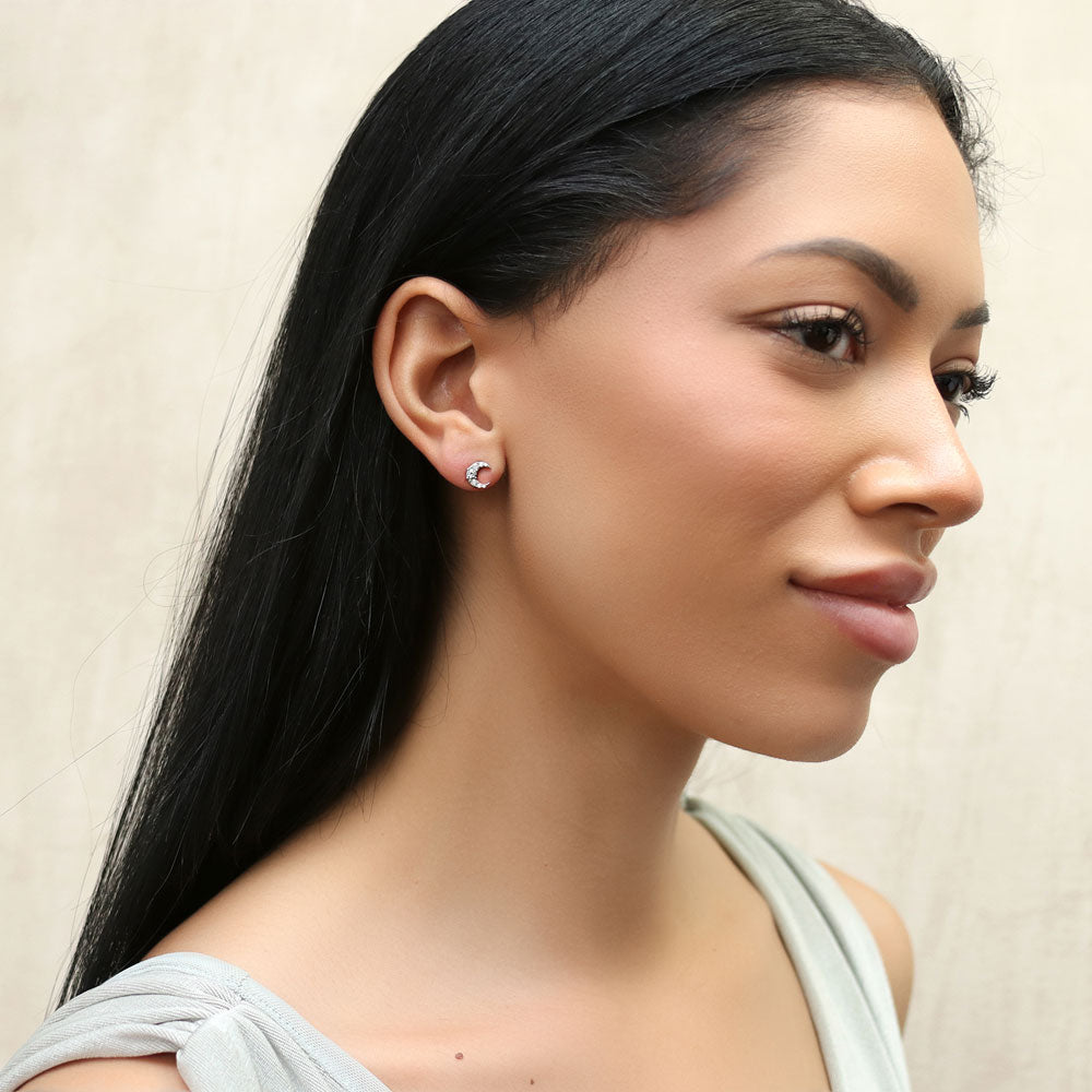 Model wearing Crescent Moon CZ Stud Earrings in Sterling Silver