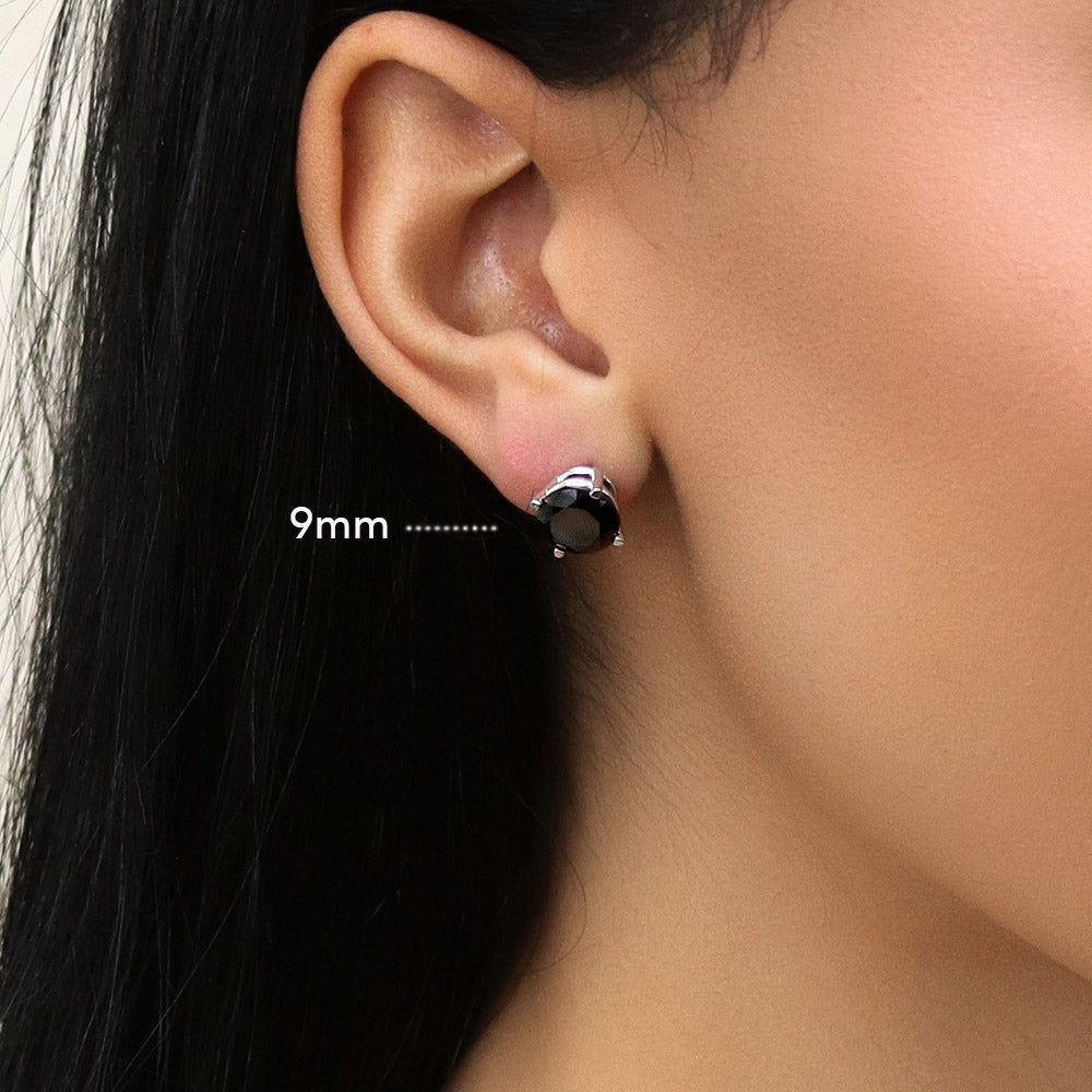 Model wearing Solitaire Black Round CZ Stud Earrings in Sterling Silver