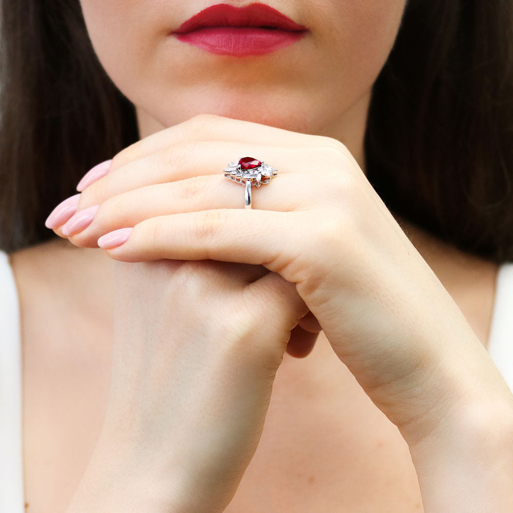 Model wearing Heart Flower Simulated Ruby CZ Ring in Sterling Silver