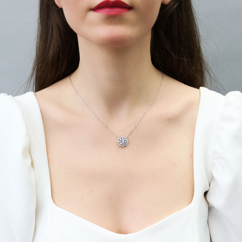 Model wearing Flower Halo CZ Necklace and Earrings Set in Sterling Silver, 12 of 14