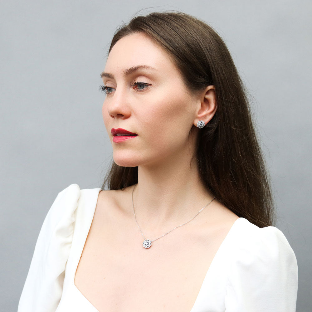 Model wearing Flower Halo CZ Stud Earrings in Sterling Silver