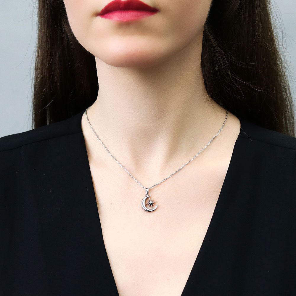 Model wearing Crescent Moon North Star Necklace and Earrings Set in Sterling Silver