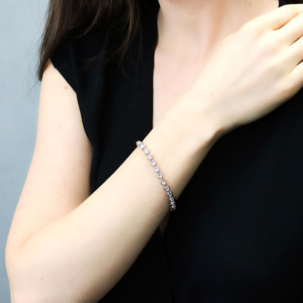 Model wearing East-West Pear CZ Statement Tennis Bracelet in Sterling Silver