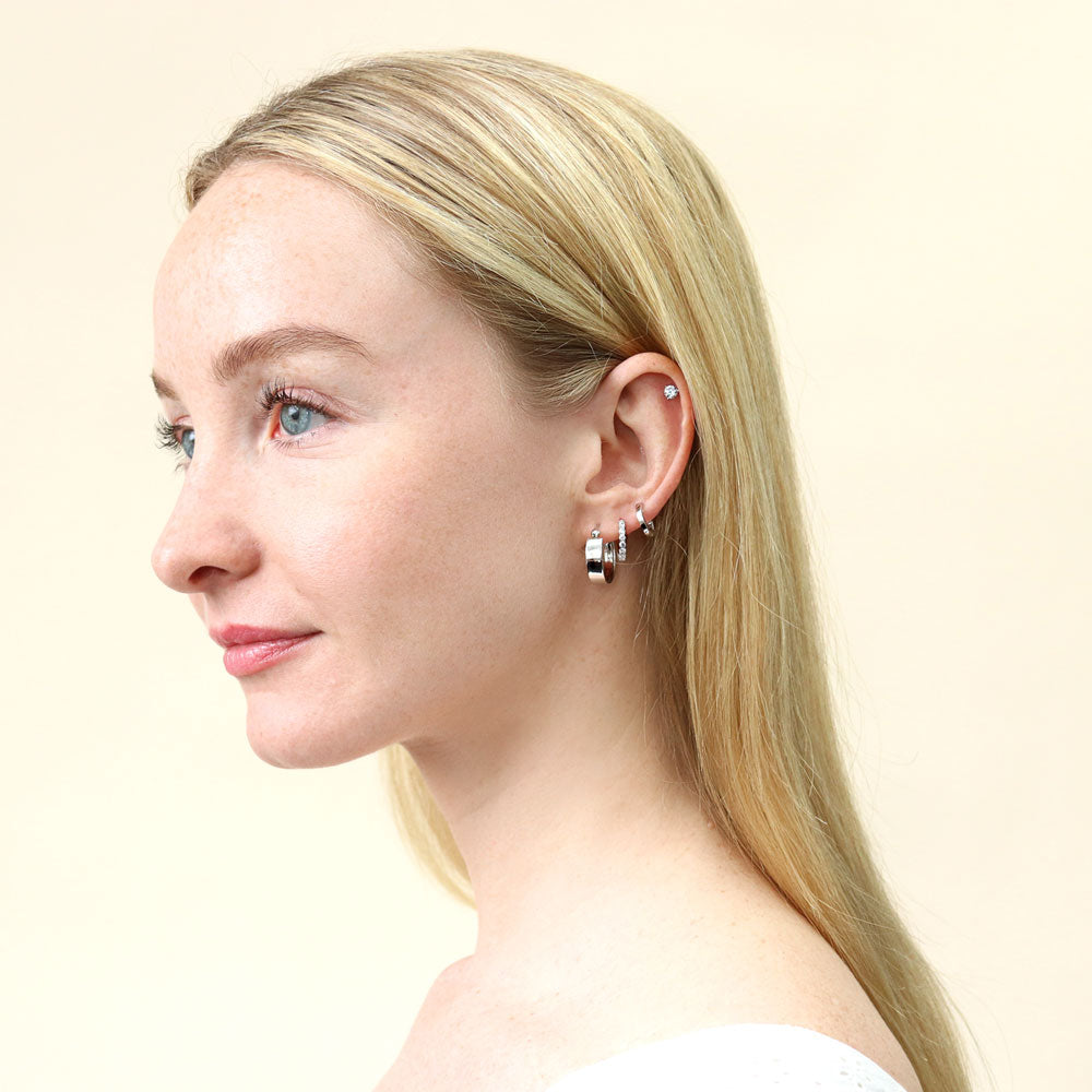 Model wearing Mini Huggie Earrings in Sterling Silver 0.45 inch