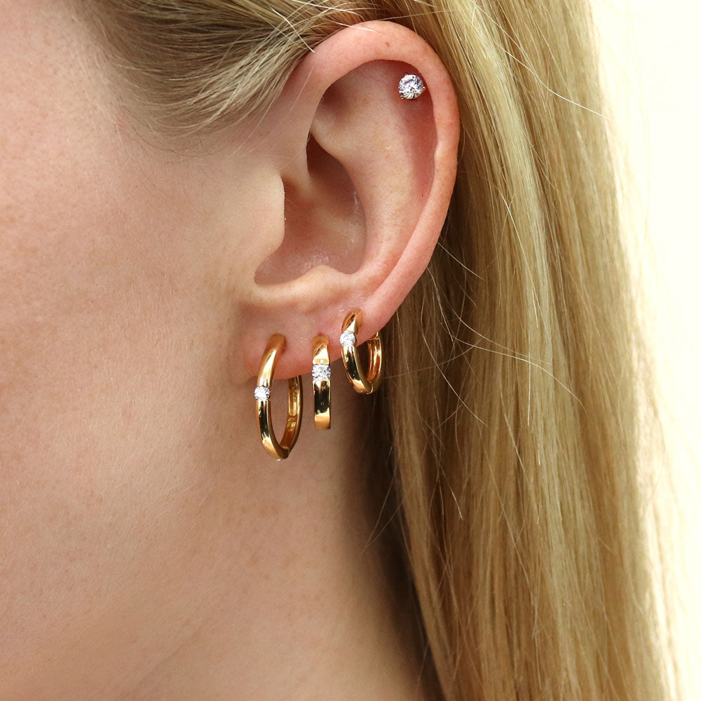 Model wearing Solitaire Round CZ Hoop Earrings in Gold Flashed Sterling Silver 0.12ct, 10 of 11