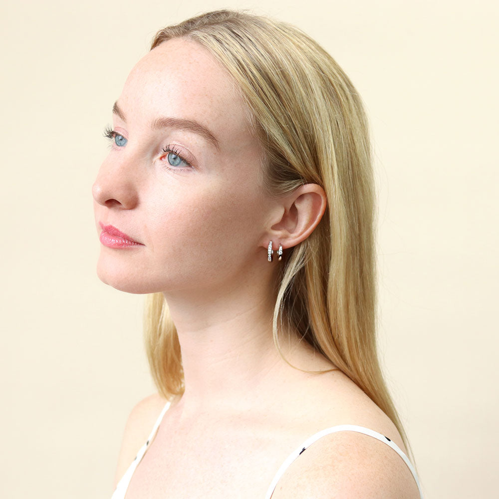 Model wearing Bar CZ Medium Hoop Earrings in Sterling Silver 0.64 inch