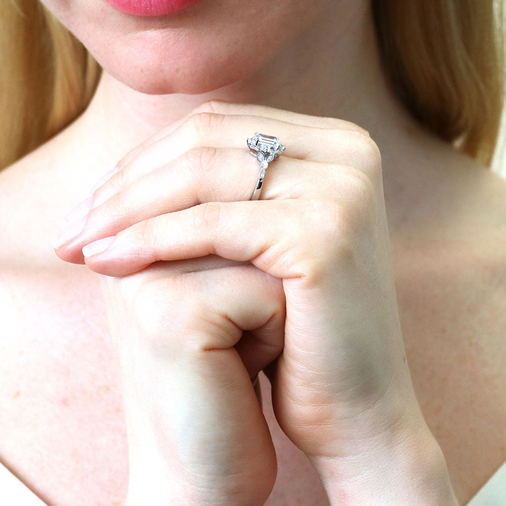 Model wearing Halo Art Deco Step Emerald Cut CZ Ring in Sterling Silver