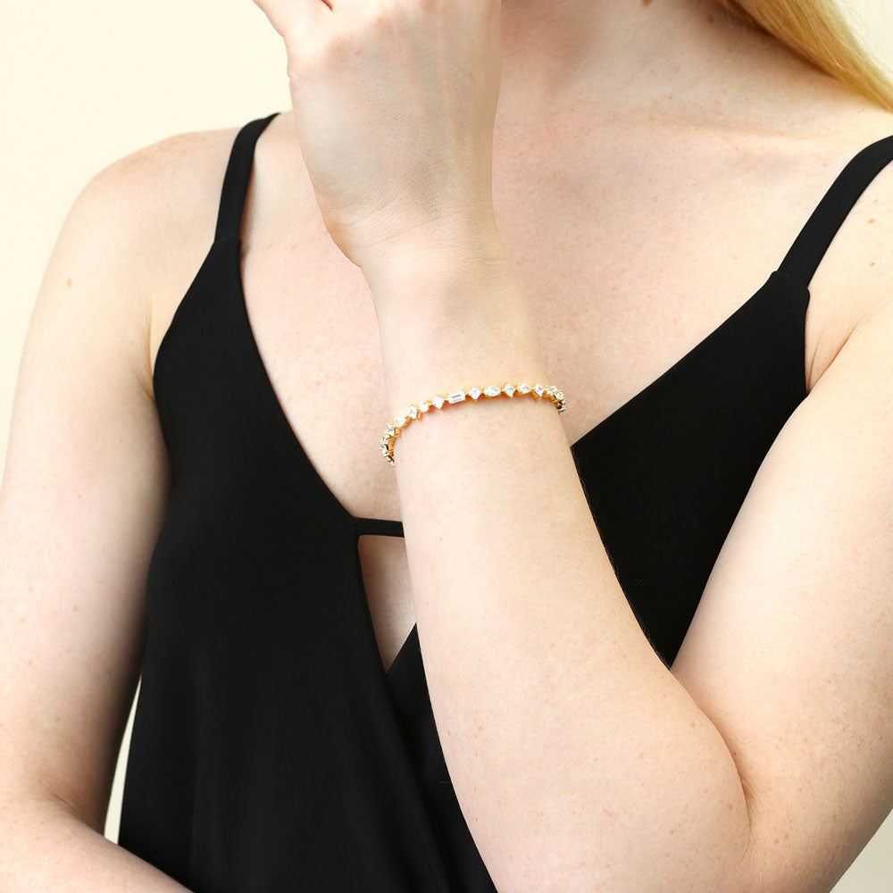 Model wearing Cluster CZ Statement Tennis Bracelet in Gold Flashed Sterling Silver