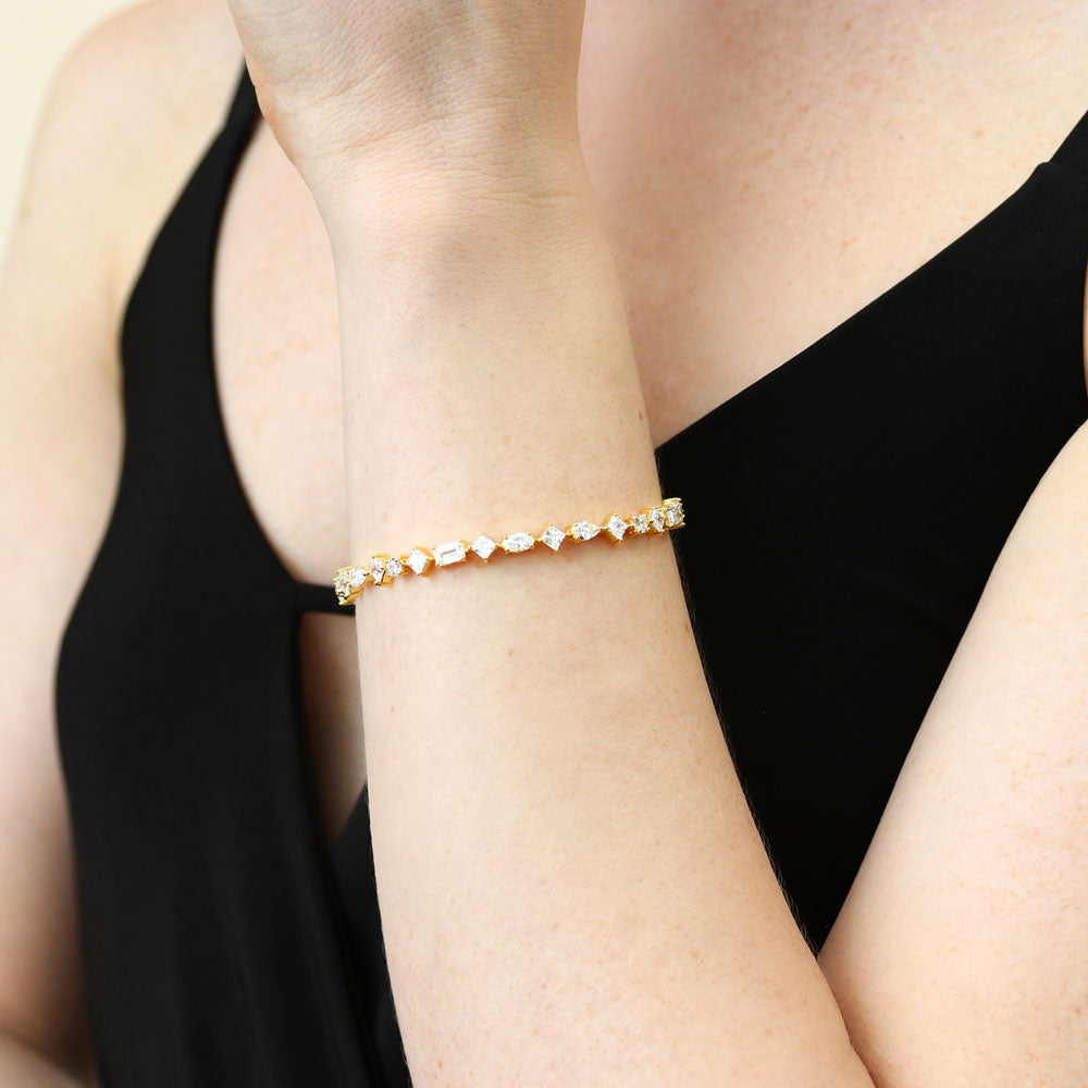 Model wearing Cluster CZ Statement Tennis Bracelet in Gold Flashed Sterling Silver