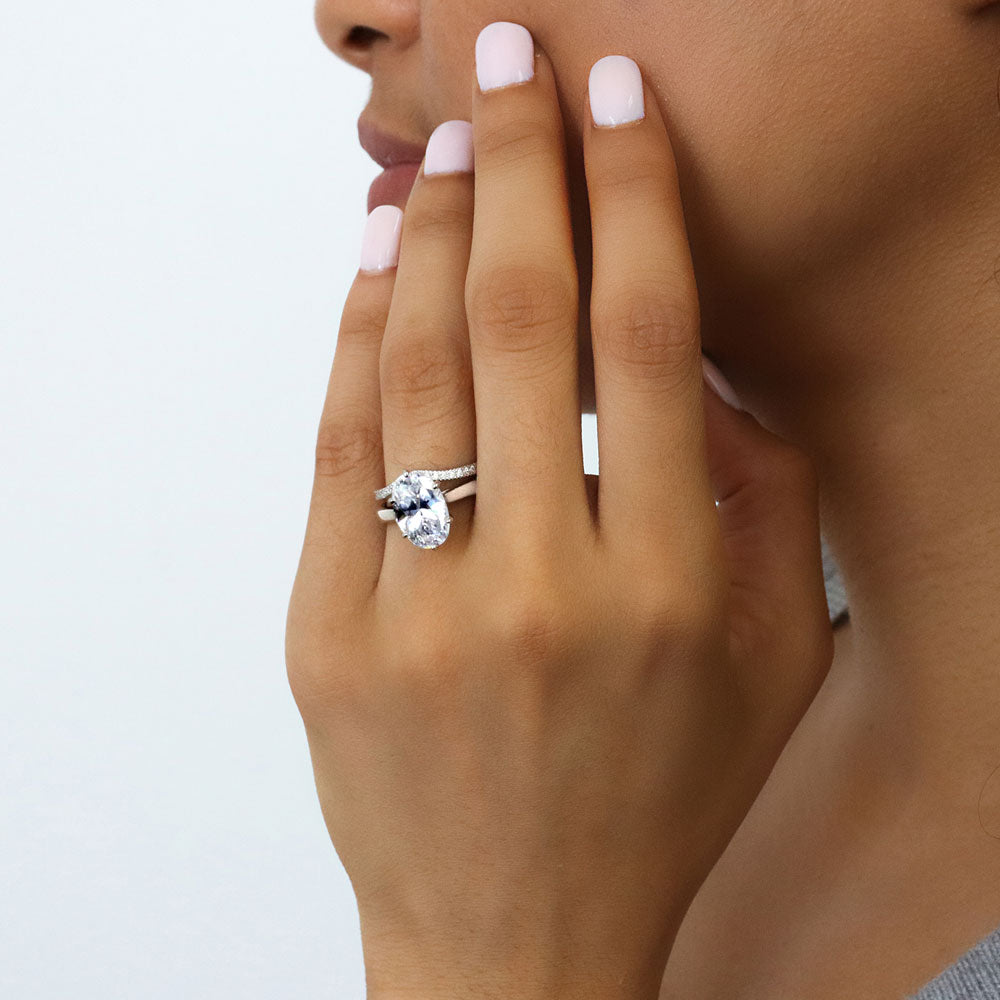 Model wearing Solitaire 3ct Oval CZ Statement Ring Set in Sterling Silver