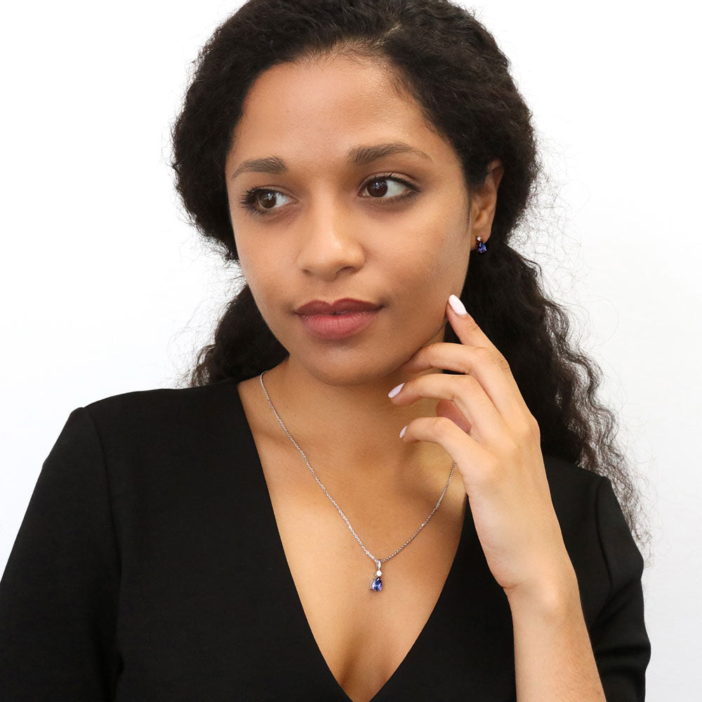 Model wearing 2-Stone Simulated Blue Tanzanite CZ Pendant Necklace in Sterling Silver