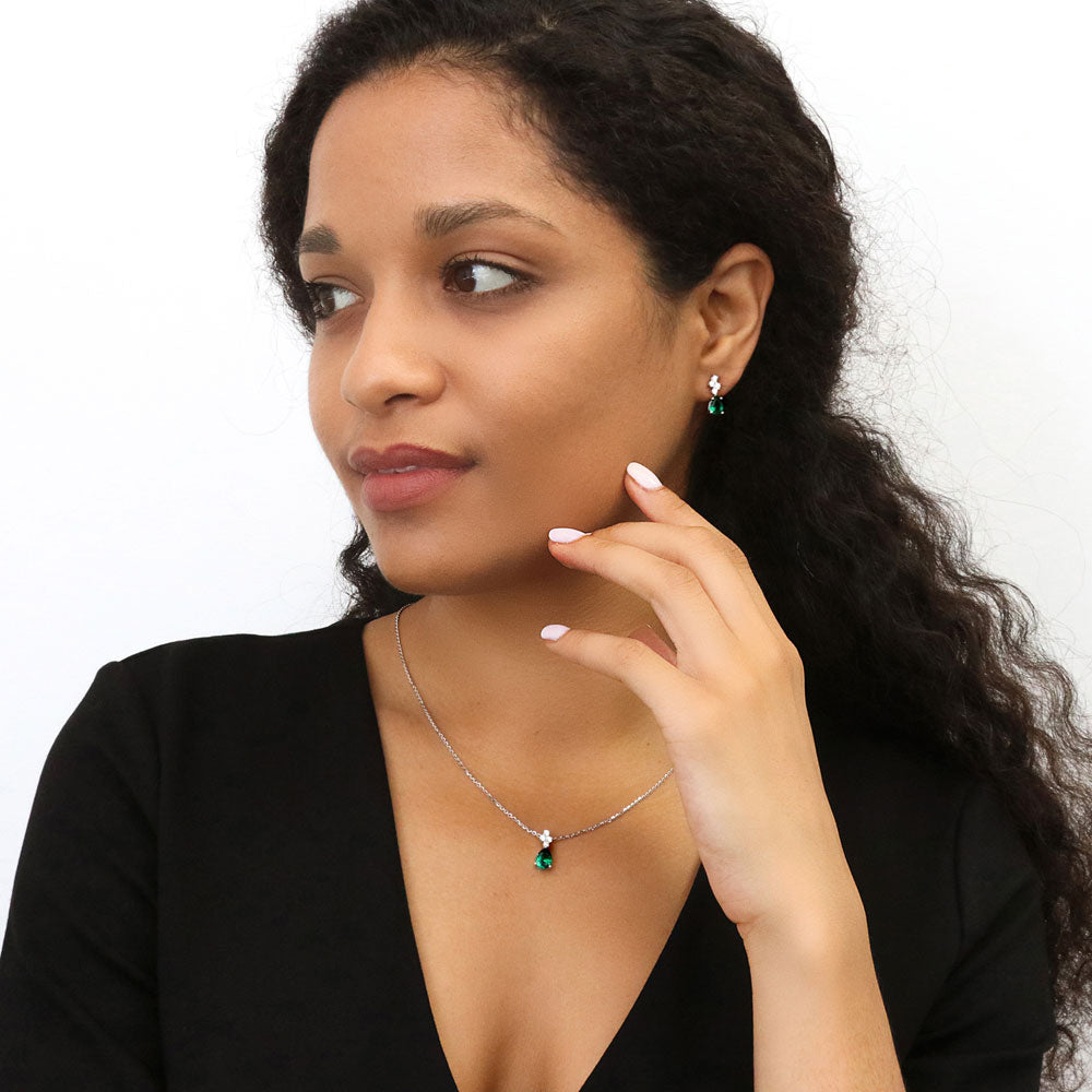Model wearing Cluster Simulated Emerald CZ Pendant Necklace in Sterling Silver