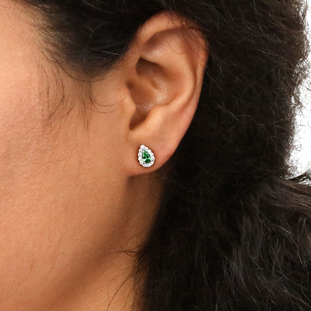 Model wearing Halo Pear CZ Stud Earrings in Sterling Silver